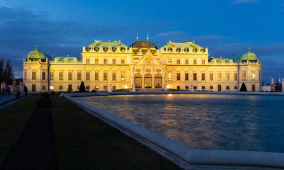 Obraz premium Illuminated Belvedere in Vienna, Austria. Historic building in Baroque style.