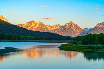 landscape of snow mountain reflecting in the lake in the morning