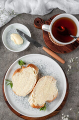 Quick breakfast, bread and butter. Shot on a concrete table in vintage style.