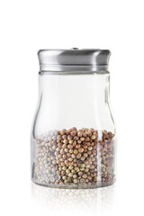 Jar with coriander on a white background.