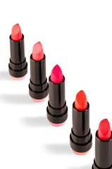 Different colors of lipstick on a white background. Decorative cosmetics.