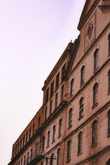 architecture photo, old factory, urban photo, street photo, pixação and graffiti, urbanism. old building, . spray graffiti , traffic sign and lamp post, background sky