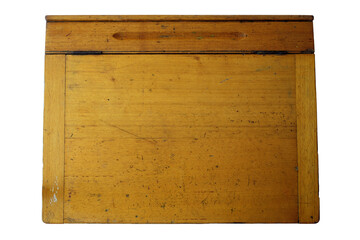 A photo of an vintage beat up worn wooden school desk. Features a hinged lid and pen or pencil groove.
