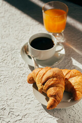 delicious breakfast, coffee and croissants on the table 