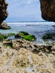 Fototapeta na wymiar beautiful scenery hiding among the huge beach rocks