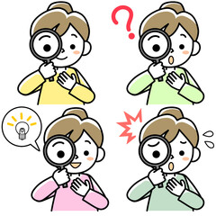 虫メガネをのぞく若い女性の上半身