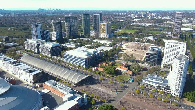 Aerial Drone Pullback Reverse View Over Sydney Olympic Park, An Inner West Suburb Of Sydney, NSW, Australia On A Sunny Day  