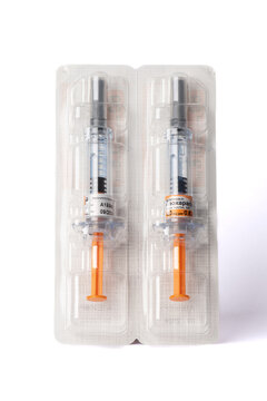 Davis, CA, July 9, 2022. Two Enoxaparin Injections 
against white background, centered, above view. This medication is used to prevent blood clots
