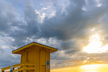 Storm Breaking Over Lifeguard Stand at Sunset on  Siesta Key Beach, Siesta Key, Florida, USA