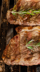 grill with traditional items from a Brazilian barbecue, sirloin steak, garlic bread. chicken drumstick, onion.