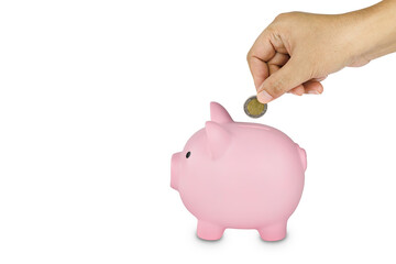 Hand putting coin to piggy bank isolated on white background with clipping path.