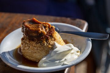 homemade egg flan with whipped cream and dulce de leche