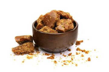 A Wooden Bowl Full of Jaggery Piece ( Cane Sugar) isolated on white background