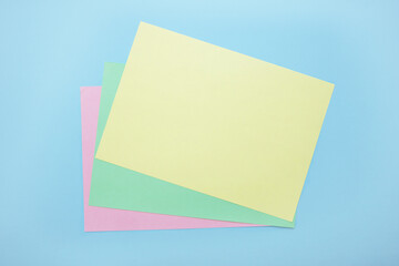 on a blue background an empty sheet of paper to fill