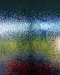 Condensation on the inside of a window in a cold damp house.