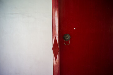 Red Chinese door with lion knocker