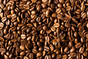 Background of roasted coffee beans full frame and star anise. 