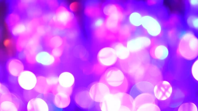 Holographic soft purple pink blue colors rays glares and bokeh. Abstract light animation. Rainbow light flares background or overlay for magic girly party