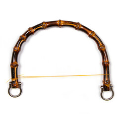 Handle for the bag made of natural bamboo.