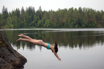 girl dives from a cliff