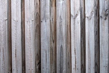 A weathered timber fence, lapped paling fence