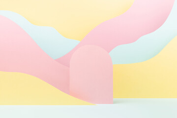 Abstract scene with pink arc podium, mountain landscape with paper pastel pink, yellow, mint color slopes in funny children style. Stage template for presentation of cosmetic, goods, advertising.