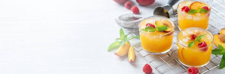Summer refreshing drink, beverage, cocktail with peach and raspberry
