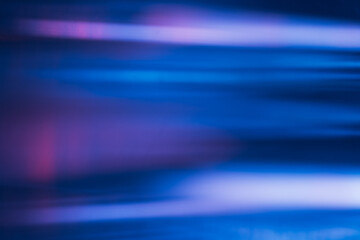 Blur neon glow. Fluorescent abstract background. Futuristic radiance. Defocused UV navy blue pink purple color light flare motion modern overlay effect.