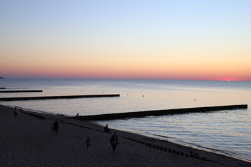 Naklejka na ściany i meble spectacular sunset on the Baltic sea beach