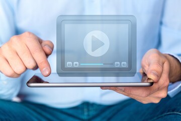 Video streaming on internet concept. Business human watching a live stream on virtual screen.Online live stream window.