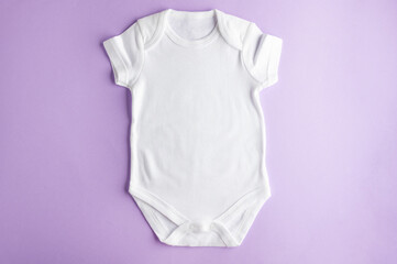 Pattern of a white cotton bodysuit for babies on a soft purple background - for boys and girls....