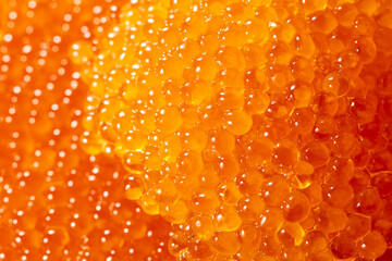Red caviar as an abstract background.