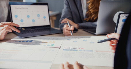 Happy young Asia businessmen and businesswomen meeting brainstorming some new ideas about project to his partner working together planning success strategy enjoy teamwork in small modern home office.