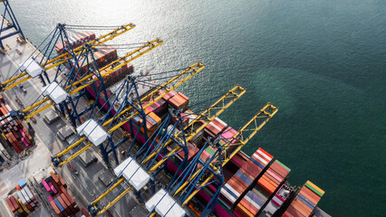 Aerial top view of container ship loading and unloading in cargo shipping port, Container cargo ship import - export terminal for the international order concept.