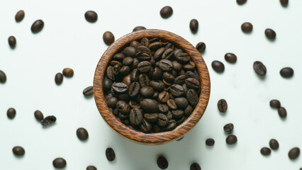 Coffee Beans in a small wood bowl. suitable for product backgrounds, advertisements, text and illustration.