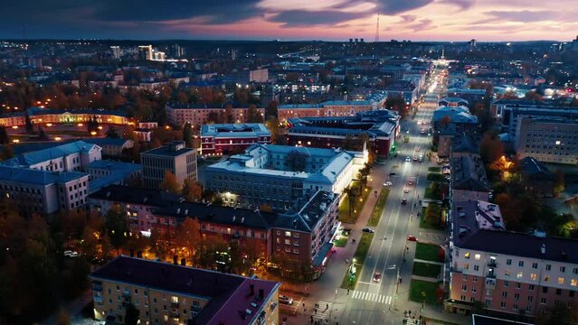 City at sunset. Aerial view of the city of Petrozavodsk in Russia during twilight. Drone flight over the night city