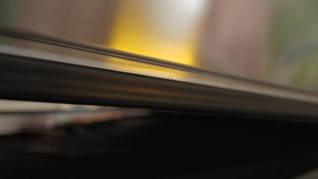 Flexo pre-press UV exposure machine closing top and begin processing flexographic plate - close up