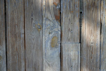 Fototapeta premium Texture of an old fence made of wooden boards close-up