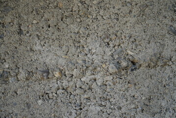 Fragment of an old concrete wall with wood inserts, close-up