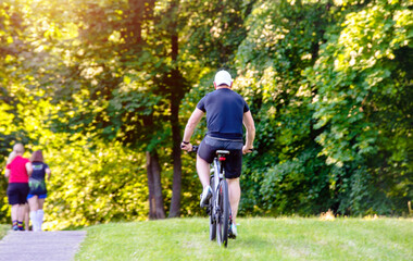 Cyclist ride on the bike path in the city Park
