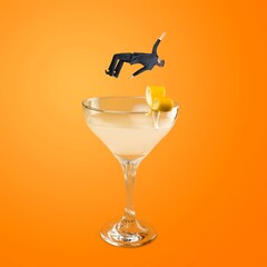 Contemporary artwork. Young person falling into refreshing tasty cocktail with fruity taste....