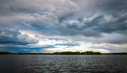Summer lake with heavy clouds
