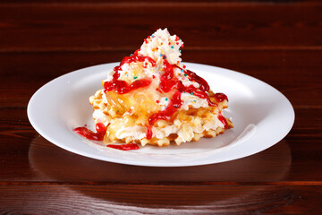 Viennese waffles with whipped cream, raspberry jam and lemon jam.