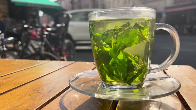 Fresh mint tea with leaves in the city