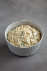 Homemade Caramelized Onion and Spinach Dip, side view.