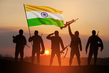 Silhouettes of soldiers with India flag on a background the sunset or the sunrise. Greeting card for Independence day, Republic Day. India celebration.