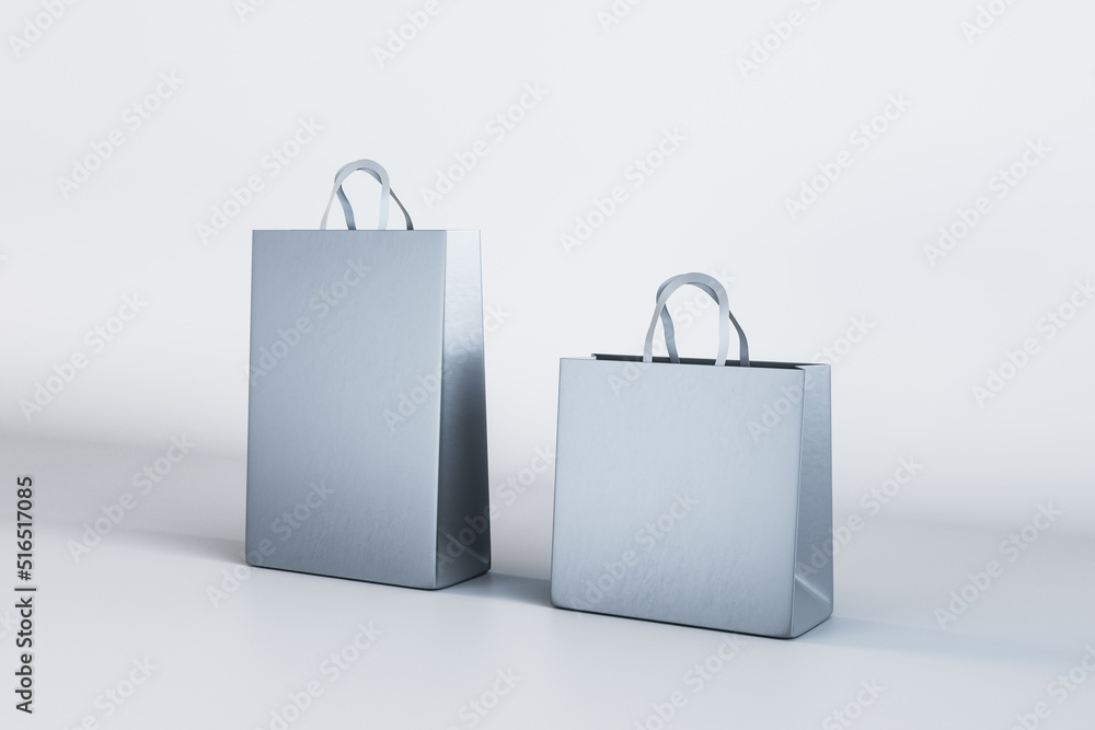 Aufkleber Two empty blue shopping bags on light backdrop. Purcashe and mock up place concept. 3D Rendering.