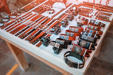 Trendy handmade leather bracelets and wristbands for sale at artisans market. Handcraft souvenir at...