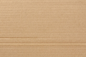 Cardboard sheet texture background, detail of recycle brown paper box pattern.