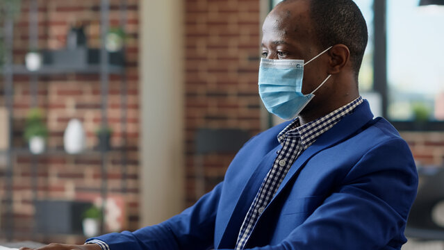 Office employee working on laptop to create business project with statistics and online research. Executive manager using network data to plan startup presentation at job. Close up.